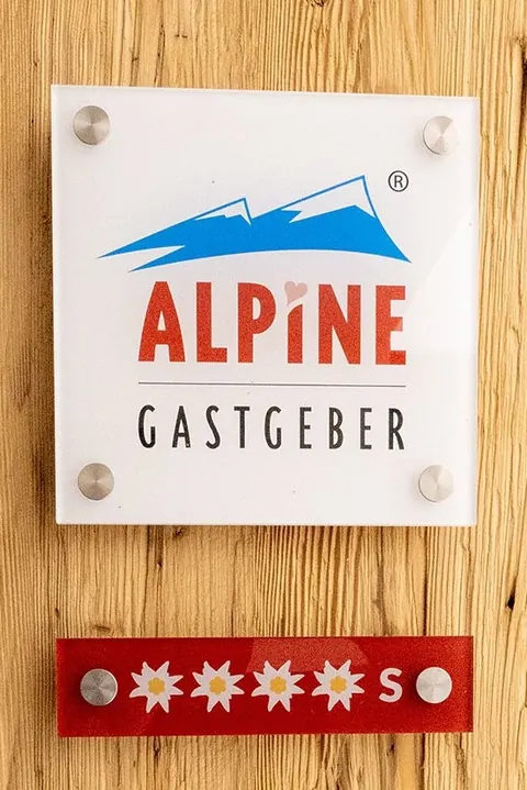 Schild Alpine Gastgeber mit 4 Edelweiß S